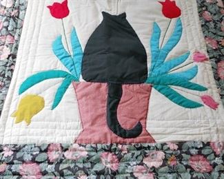 Hand quilted table top cover.