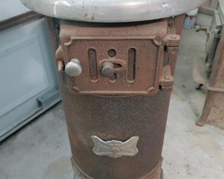 Cast iron stove with nickel rim