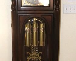 Howard Miller grandfather clock Model #611-042.             23" W x 85" H x 13 1/2" D.