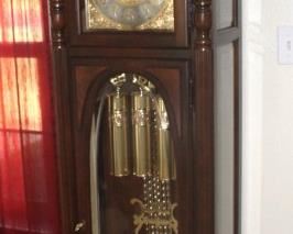 Howard Miller Grandfather Clock.  Has a beautiful tone!  23" W x 85" H x 13 1/2" D. 
