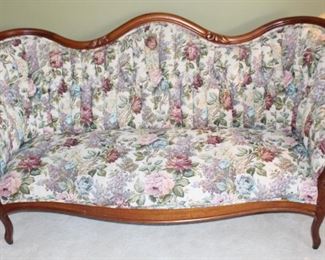 Lovely antique parlor sofa.  The floral fabric and upholstered channels make this an exquisite addition to any home! 70 1/2" W x 32" D x 36" H.