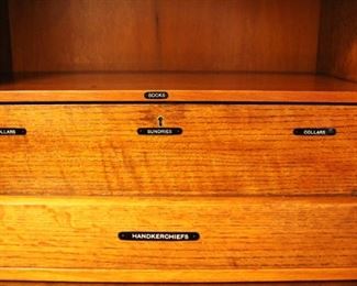 The wardrobe has porcelain tags to identify unique storage areas.  