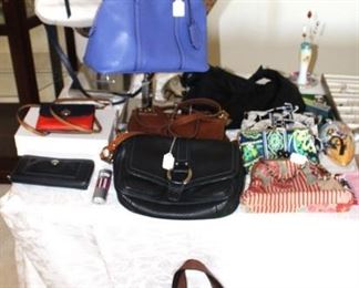 Coach, Vera Bradley, and House of Disaster purses/handbags.