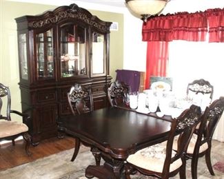 Beautiful, like new, dining room furniture. China/display cabinet, dining table with six chairs (two are arm chairs).  Table comes with two leaves and protector pads/covers.  Table measures 44" x 78"