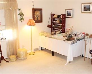 No furniture in this bedroom, but it is filled with home decor, collectibles, candles, clothing items and much more.
