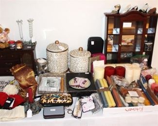 Table is full of candles and misc. items.