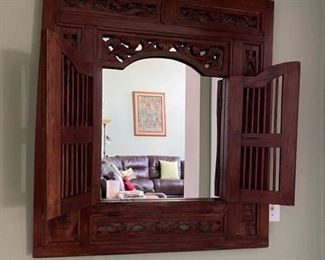 Carved wooden mirror with closing shutters from Mexico