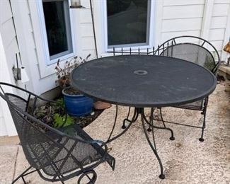 Metal patio table and four chairs