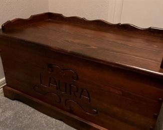 Custom-made wooden hope chest with "Laura" engraved on the front (can be easily covered over)