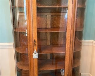 Antique oak bow front china cabinet in immaculate condition