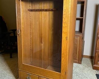 Vintage Oak Glass Door Rifle Cabinet 	58 x 31.5 x 13.5in	HxWxD


