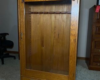 Vintage Oak Glass Door Rifle Cabinet 	58 x 31.5 x 13.5in	HxWxD
