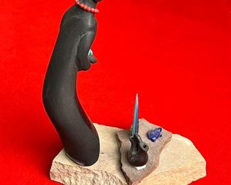 Unsigned Native America Black Ware Figure Pottery	7.5 inches high.	
