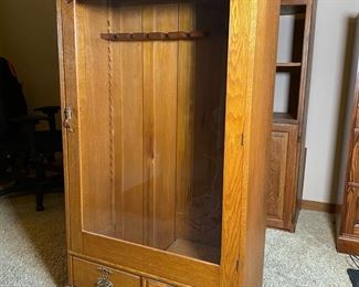 Vintage Oak Glass Door Rifle Cabinet 	58 x 31.5 x 13.5in	HxWxD
