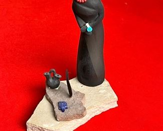 Unsigned Native America Black Ware Figure Pottery	7.5 inches high.	
