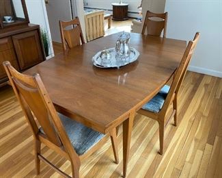 Mid Mod dining table: 66" long, 43" wide, two 18" leaves with 6 chairs - 2 of them are arm chairs ( not shown  )