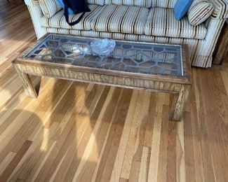 Fretwork , glass topped cocktail table 