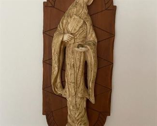 Chalk ware figure on teak