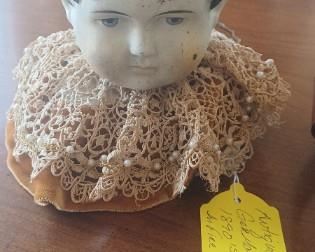 1890s doll was in fire head was saved