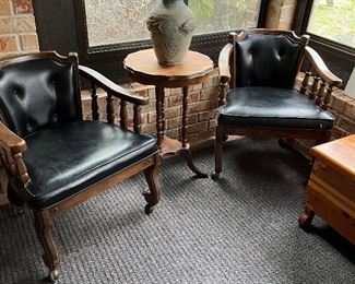 rolling black mid-century arm chairs