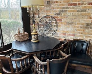 rolling black mid-century arm chairs and octagonal dining table