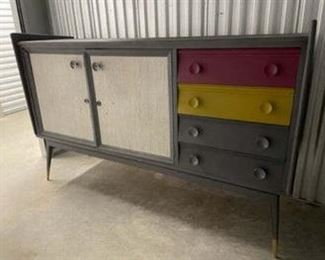 $175 USD     Gray / Multi Colored Drawer Hutch Made in Spain PA107-4      Brighten your foyer or living room with a statement piece that brings your decor a perfect balance of modern and vintage design. This distressed cabinet features rich modern colors in saturated tones of white, pink, yellow and gray.  This piece offers four drawers and two cabinets that provides you ample storage space for organizing all of your items. With both exquisite style and practical function, this Spanish beauty provides exceptional craftsmanship to any interior space.

67 x 20 x 42.5H

Local pick up SE Washington, D.C.  Contact us for shipper suggestions.     https://goodbyhello.com/products/gray-multi-colored-drawer-hutch-made-in-spain-pa107-5?_pos=6&_sid=7ea65b4aa&_ss=r