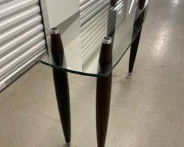 $225 USD     Mid Century Modern Glass 2 shelf Coffee Table PA107-7      Mid Century Modern glass top coffee table.  This piece originally had a second glass top that sat atop the four double tapered legs. 

DIMENSIONS: 41 x 13 x 30H

LOCATION: Local pick up NE Washington, D.C.  Contact us for shipper suggestions.

CONDITION: Used. The table is in good vintage condition. As noted the top glass shelf is missing.     https://goodbyhello.com/products/mid-century-modern-glass-2-shelf-coffee-table-pa107-7?_pos=7&_sid=7ea65b4aa&_ss=r