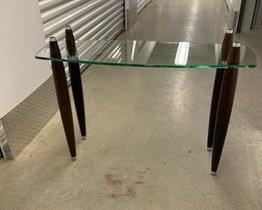 $225 USD     Mid Century Modern Glass 2 shelf Coffee Table PA107-7      Mid Century Modern glass top coffee table.  This piece originally had a second glass top that sat atop the four double tapered legs. 

DIMENSIONS: 41 x 13 x 30H

LOCATION: Local pick up NE Washington, D.C.  Contact us for shipper suggestions.

CONDITION: Used. The table is in good vintage condition. As noted the top glass shelf is missing.     https://goodbyhello.com/products/mid-century-modern-glass-2-shelf-coffee-table-pa107-7?_pos=7&_sid=7ea65b4aa&_ss=r