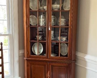 Stunning antique corner cabinet with a ton of storage.