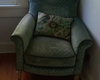 recovered green chair with roll arms and caster wheels