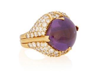 3
An Amethyst And Diamond Ring
18k yellow gold
Centering a fancy cabochon-cut amethyst gauged at 20.0mm x 16.2mm accented by ninety-two round full-cut diamonds totaling approximately 6.00cts. in weight and graded G-H color and VS clarity
Ring size: 3.75
26.3 grams
0.75" W x 0.875" H
Estimate: $2,000 - $3,000