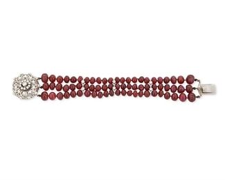 11
A Ruby And Diamond Bracelet
14k white gold
A triple strand bracelet set with ruby beads tapering in diameter from 5.8mm - 8.8mm further designed with three bar enhancers set with six round full-cut diamonds and a circular clasp set with thirty-one round full-cut diamonds all with a total approximate weight of 2.50cts. and each graded H-I color and VS/SI clarity
53.4 grams
6.75" L x 1.0" W
Estimate: $3,000 - $5,000