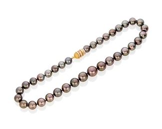27
A Tahitian Cultured Pearl Necklace
Yellow metal
With cultured pearls graduating in size from approximately 11.0mm to 15.3mm and completed by a yellow metal barrel magnet clasp set with twenty-three round full-cut diamonds totaling approximately 0.35ct. in weight and graded I-J color and SI/I clarity
101.3 grams
19.0" L
Estimate: $1,500 - $2,000