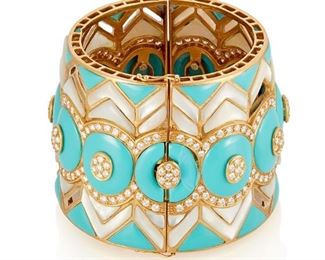 32
A Mother-Of-Pearl, Turquoise And Diamond Bangle Bracelet
18k yellow gold; Stamped: 750
A wide hinged bangle bracelet featuring carved mother-of-pearl and turquoise further set with two hundred forty-five round full-cut diamonds totaling approximately 12.25cts. in weight and graded G-H color and VS/SI clarity
174.0 grams
6.0" - 7.0" Cir x 2.125" W
Estimate: $8,000 - $12,000