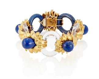 40
A David Webb Rock Crystal And Lapis Lazuli Bracelet
18k yellow gold; Stamped: Webb / 18k / © / ®
A David Webb 18k yellow gold bracelet designed with three carved oval rock crystal links, two circular carved round lapis lazuli links and topped with five carved teardrop shaped lapis lazuli stones each gauged at approximately 12mm in diameter
107.6 grams
6.5" L x 1.125" W
Estimate: $6,000 - $8,000
