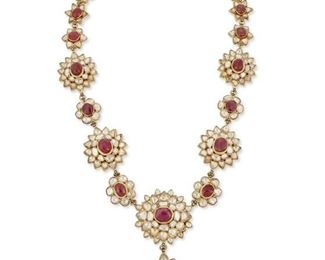 47
An Indian Ruby, Diamond And Enamel Necklace
High karat gold
Featuring twenty tumbled bezel set rubies ranging from 5.7mm x 6.3mm - 13mm x 11.5mm further set with two hundred thirty tablet-cut diamonds ranging in size from 4.9mm x 4mm - 7.7mm x 5mm and graded H-K in color and SI/I1 in clarity and the reverse of the necklace displaying an intricate multi-colored enamel floral motif
335.4 grams
27.0" L x 1.5" W x 3.5" H
Estimate: $12,000 - $18,000