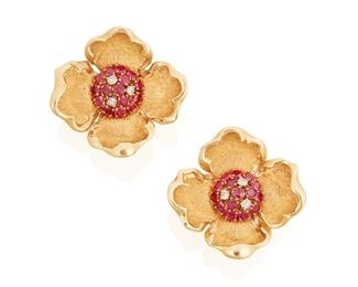 56
A Pair Of Retro Ruby And Diamond Flower Ear Clips
18k yellow gold
Centering thirty round mixed-cut rubies totaling approximately 3.25cts. in weight and six round single-cut diamonds totaling approximately 0.40ct. in weight and graded H-I color and SI2 clarity
21.5 grams
2 pieces
1.375" Dia
Estimate: $800 - $1,200