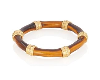 77
A Mish Jungle Bamboo Tiger's Eye And Diamond Bangle Bracelet
18k yellow gold; Stamped: MISH NY / 18
A Mish New York tiger's eye "Jungle Bamboo Bangle" accented with sixty round full-cut diamonds totaling approximately 0.75ct. in weight and graded brown in color with VS clarity
45.2 grams
6.5" Cir x 0.375" W
Estimate: $1,000 - $1,500