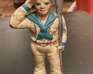 Antique Painted Cast Iron Sailor Coin Bank. 