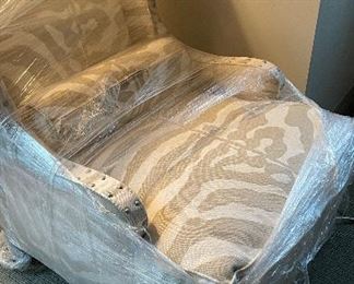 Pair of Scalamandre Wing Back Club Chairs Upholstered in Scalamandre Sahara Zebra Fabric with Nailhead Trim. Each Chair Measures 30" W x 40" D. Photo 1 of 2.