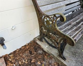 Cast iron and wood bench that rocks 