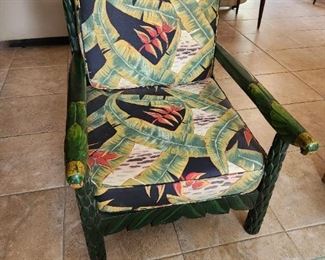 Carved wood chair with jungle and parrot motif