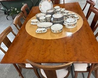 Annibale Colombo Round Dining table with 2 specialty leaves that make it into a rectangle,  two sets of four Ethan Allen chairs - sold separately