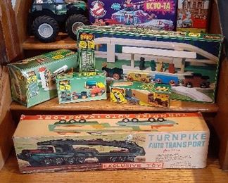 Ghost Busters echto-1a, TMNT cruiser, Brio wooden train and tracks, grave digger, Turnpike auto transport tin truck, Pluto doll, Santa Bears, 