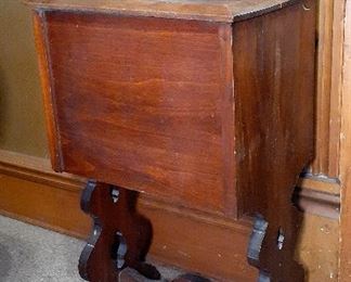 antique sewing cabinet, cast iron 