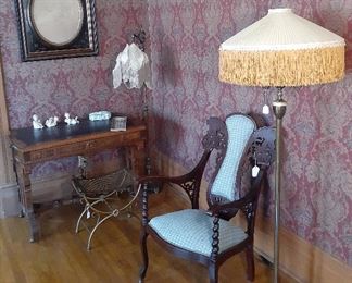 Victorian furniture, ornate arm chair, floor lamps with fringed shades