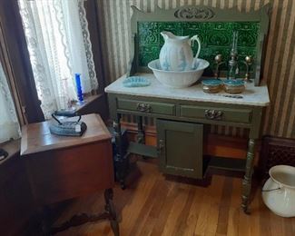 painted marble top wash stand w/tile background wash pitcher and commode. 
