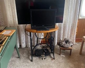 TV's and TV Table base from antique sewing machine