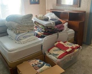 Maple bed and lots of old quilts