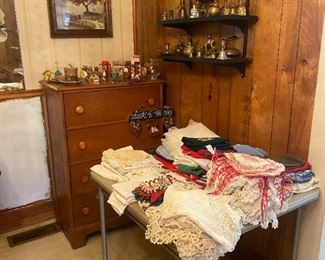 Chest of drawers and antique dollies and lace pieces